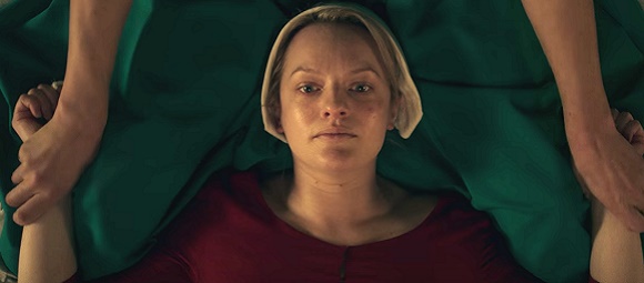 elizabeth-moss-in-the-handmaids-tale-sex-ceremony